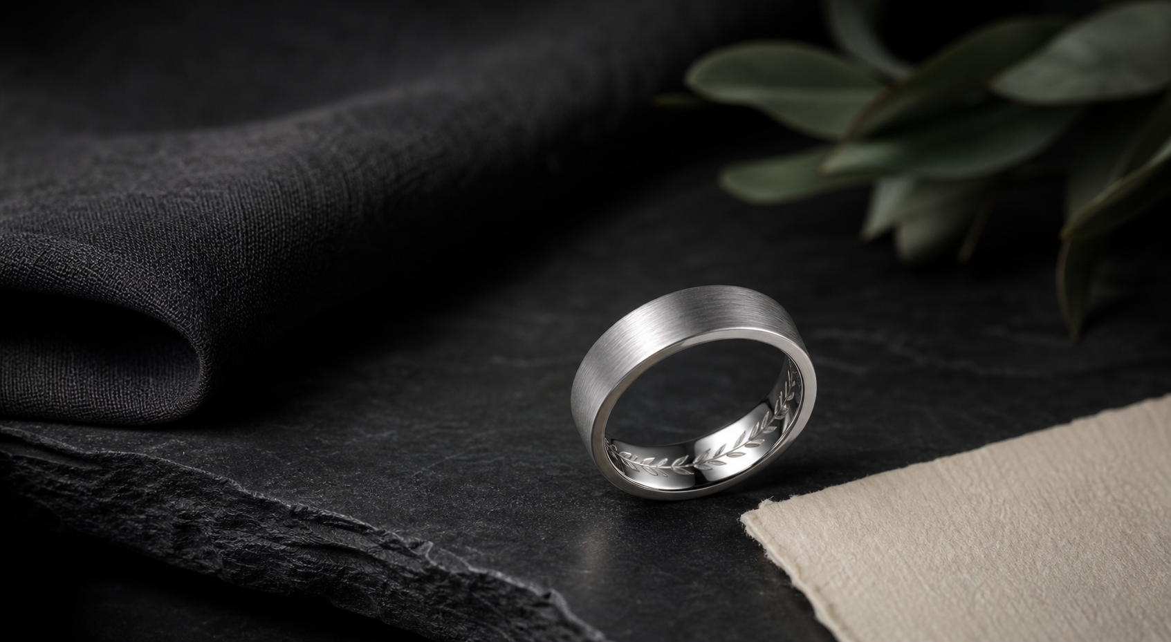 Premium tungsten engraved rings image with a dark brushed ring and material details